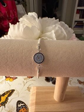Silver-Tone Blue Pave Bolo Bracelet on White Cord. Fits most adjustable